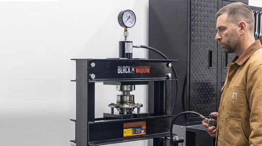 Pressing bearings out of compatible wheel hubs and install replacements in your shop