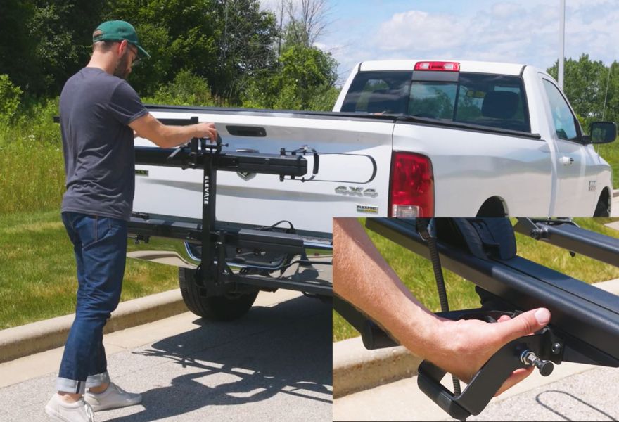 Man uses easy-pull handle to store carrier vertically against vehicle