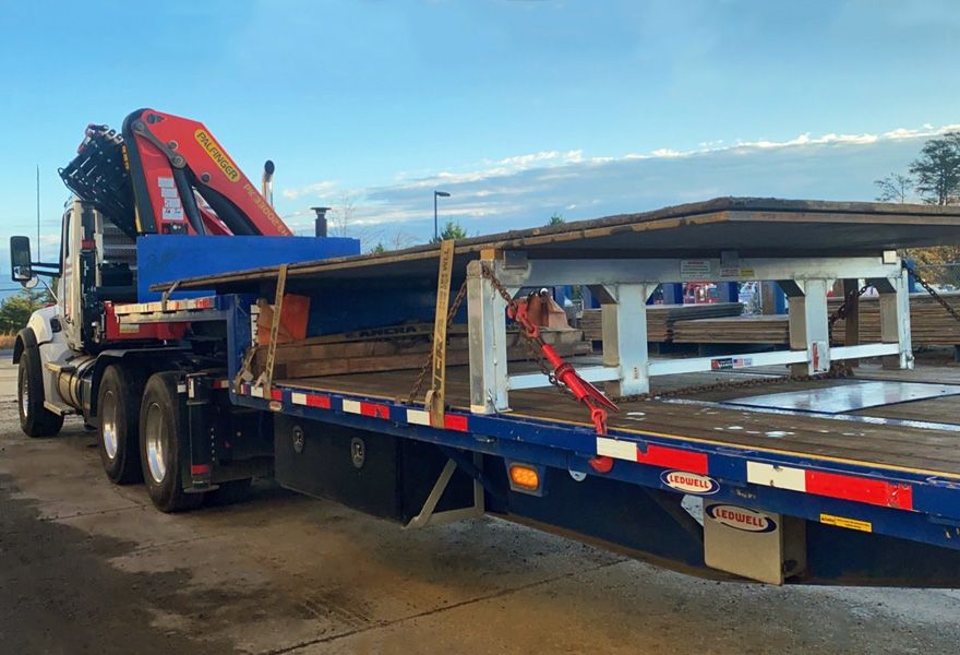 step deck trailer carrying boards