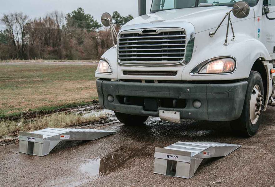 semi-tractor preparing to drive up service ramps