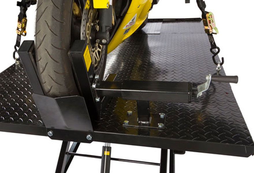 Built-in adjustable wheel clamp vise, wheel stop and tie-down points secure bike to table