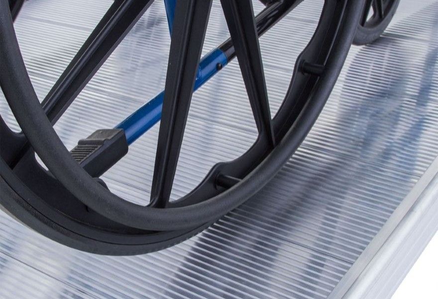 textured wheelchair ramp with side curbs