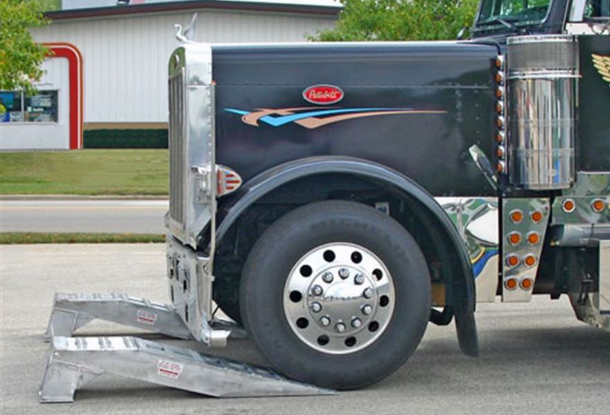 semi-tractor preparing to drive up service ramps