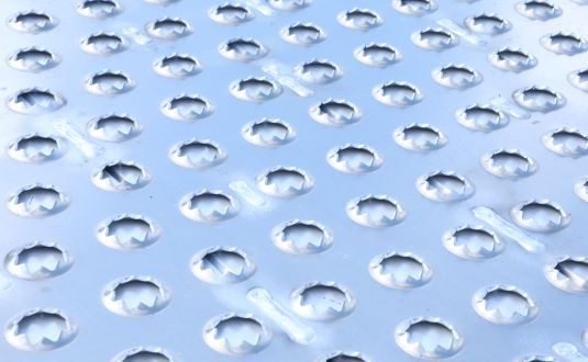 EZ Traction punch-plate surface grips tires in all weather