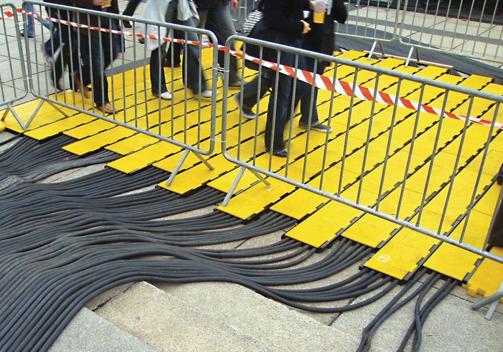 Checkers Yellow Jacket AMS Cable Protector System in action in a city
