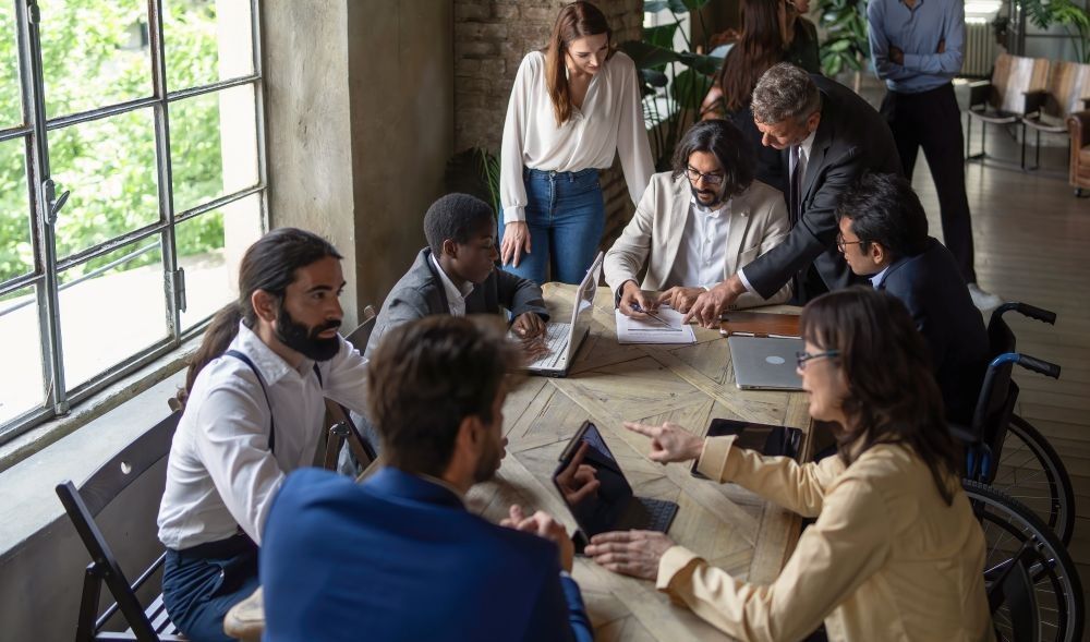 A picture of a group of coworkers in an office where inclusivity is prioritized.