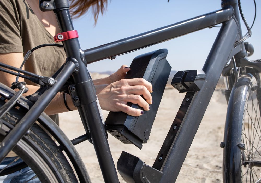 woman removing ebike battery