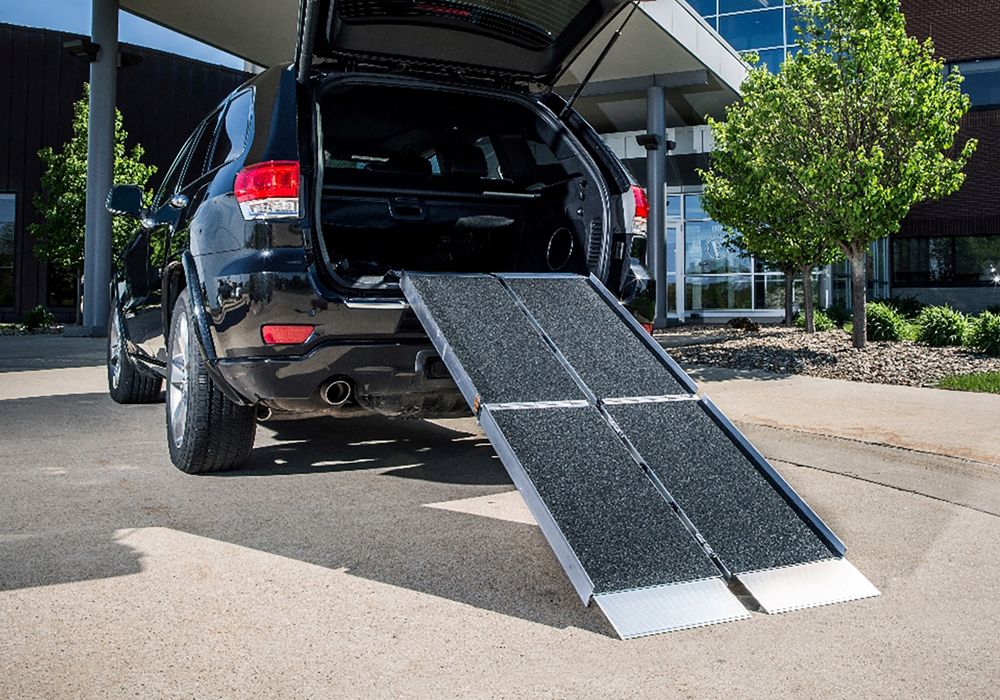 loading ramps on a car in a driveway