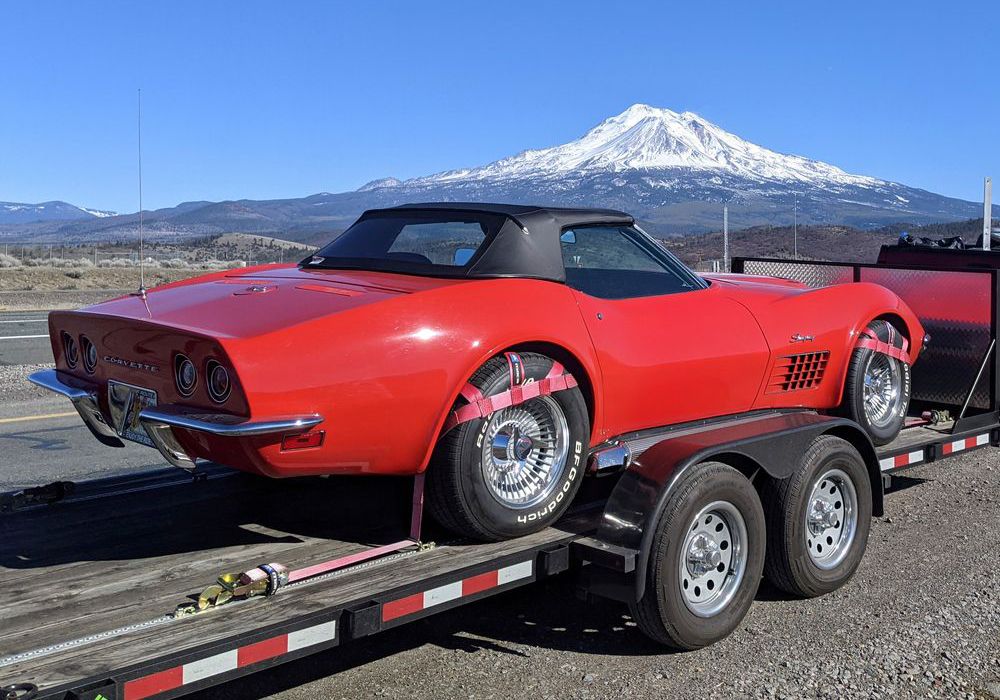 Corvette transported on trailer with wheel nets