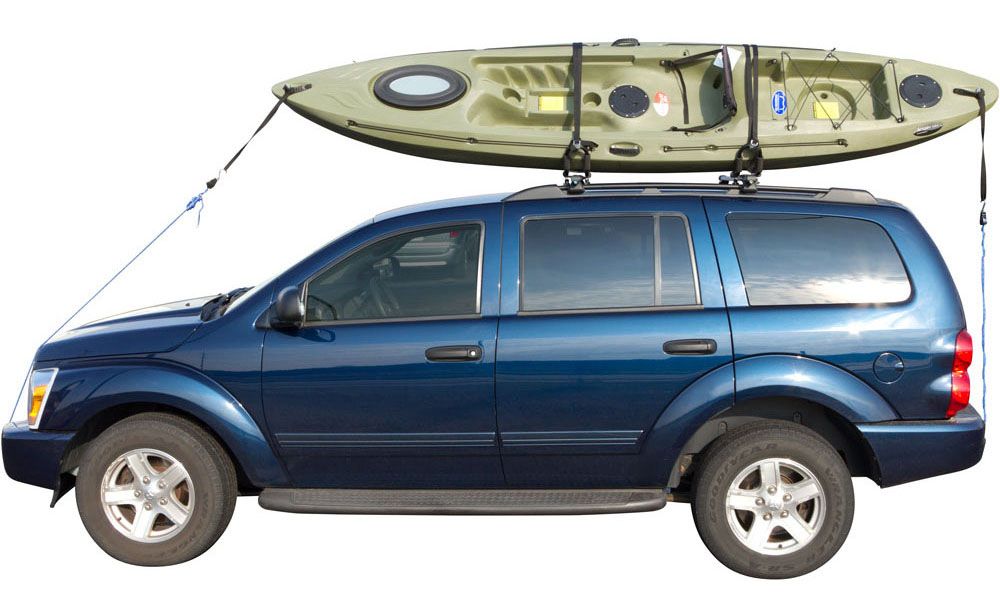 kayak tied to a roof carrier on top of a vehicle