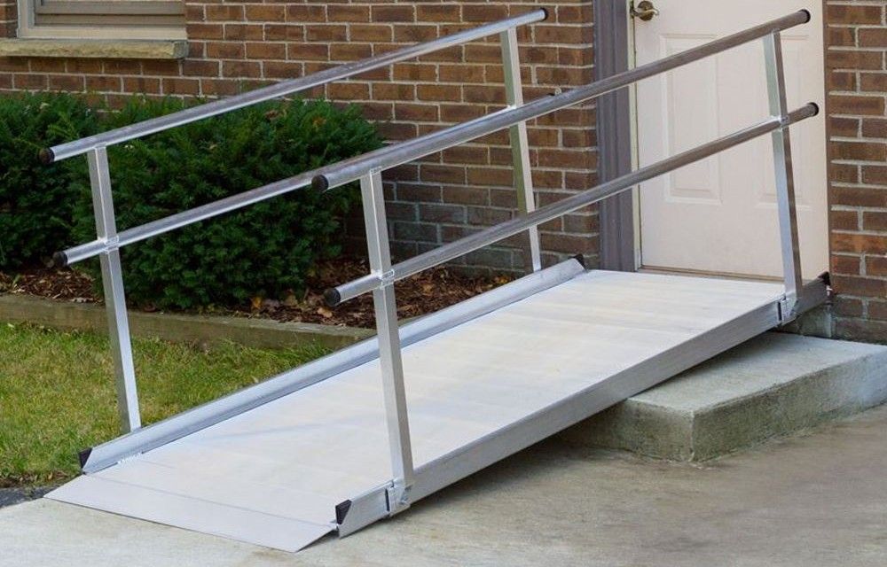 The Silver Spring Aluminum Wheelchair Access Ramps with Handrails is designed for scooters and wheelchairs in residential settings and features seamless construction, a slip-resistant surface, and a self-adjusting ground transition plate