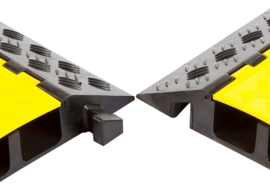 Trapezoid connectors on cable protector ramp
