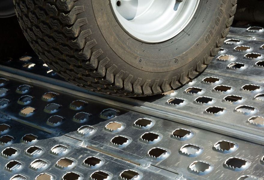 Wheel on punch plate aluminum trailer ramps