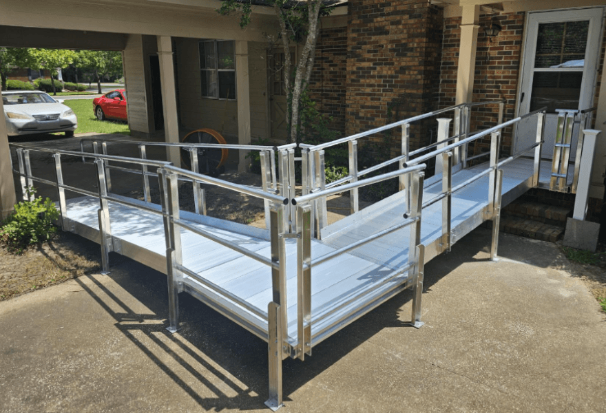 Textured aluminum wheelchair ramp with integrated handrails